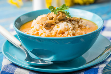 Tomato soup with rice.