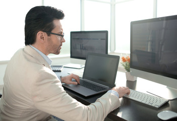 businessman using modern technologies for financial data processing - Powered by Adobe