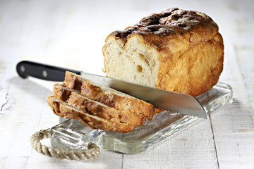 Frisian Suikerbrood (sugarbread) with knife on glass plate