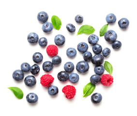 blueberries with raspberries isolated on white bacgkround
