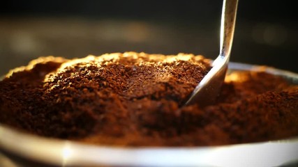 Spoon take freshly ground coffee. Brew smelling morning coffee. Cooking hot bracing drink. Arabica cup.