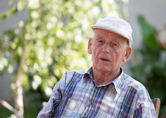 Portrait of elderly man in park
