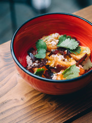 Fried yolk balls with meat in bowl plates