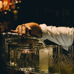 Bartender making cocktail glass in bar restaurant