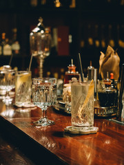 Fototapeta na wymiar Gin tonic cocktails in glasses in bar stand