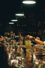 Bartender making cocktail glass in bar restaurant