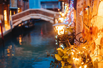Venice canal late at night with street light illuminating