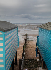 Beach huts by the sea in the UK