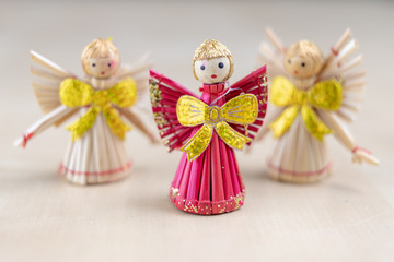 Fototapeta premium Christmas decorations on the kitchen table. Wooden Christmas figurines prepared for decorating a tree.