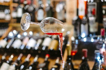 Glass of Wine Falling Mid Air with Spill