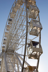 Ferris wheel against the blue sky.