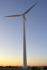 Fototapeta na wymiar Windmills turbine, renewable electric energy concept