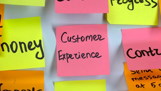 Inscription on the sticker customer experience on a sticker pasted on a board