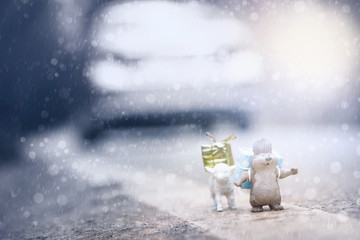 Animals(miniature/figurine) carrying gift boxes.Merry Christmas and Happy New Year concept background.