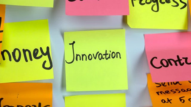 Sticker with the words innovation on a white board