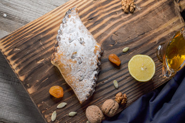 Arabic Sweet , wooden background board. Top view.