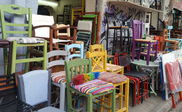 Many old chairs on street market for sale