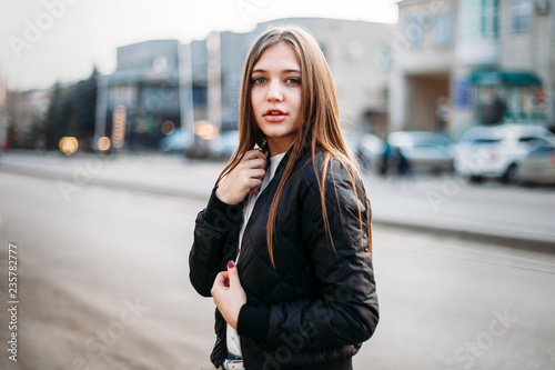 Fashion Girl Wearing T Shirt And Leather Jacket Posing