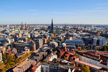 Obraz premium City streets of Germany. Panoramic view of the city of Hamburg from a height. Photo of Hamburg from a height. Cityscape houses and streets.