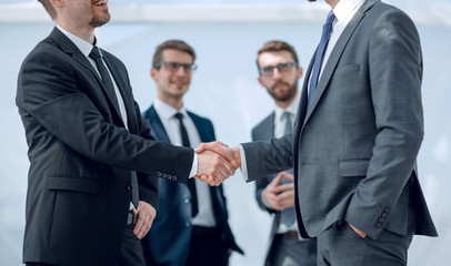 successful business partners shaking hands