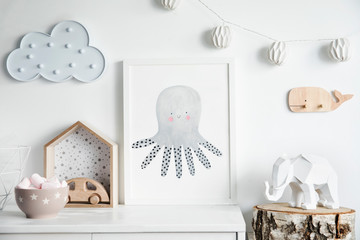 Stylish scandinavian newborn baby room with wooden toys, elephant, cotton lamps and cloud. Modern...