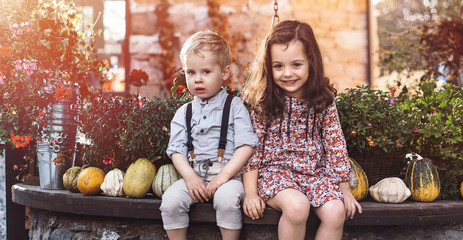 Portrait of little siblings on a farm