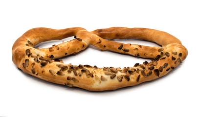 Isolated close-up of bagel seeds on a white background