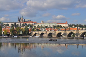 Obraz premium Historical center in Prague. Travel to the Czech Republic. Vltava River and Charles Bridge.