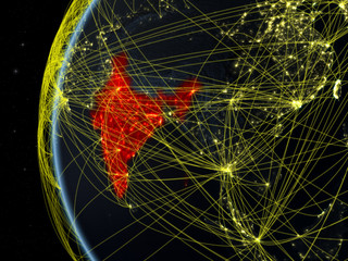 India from space on model of Earth at night with international network. Concept of digital communication or travel.