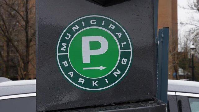 TORONTO, CANADA on April 25th: Municipal parking sign on April 25th, 2017 in Toronto, Canada. The Toronto Parking Authority or Green P is a public corporation owned by the city of Toronto.