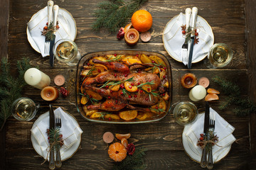 Christmas dinner with duck and fruit, festive table setting, New Year. Flat-lay
