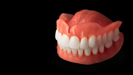 dentures. Isolate on white background acrylic prosthesis of human jaws. The concept of orthopedic dentistry