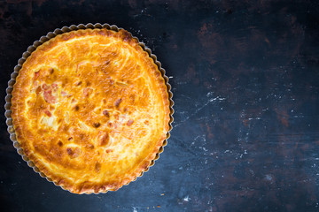 italian homemade rustic pie on a black wooden board