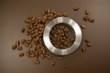 Crude pine nuts on brown background top view. Organic and healthy food.