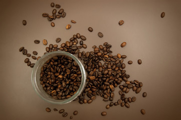 coffee canister lid and coffee beans scattered on the table