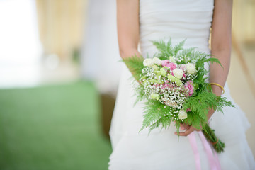 Obraz na płótnie Canvas wedding flower on bride hand, bouquet flower