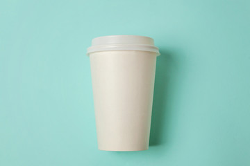 Simply flat lay design paper coffee cup on blue pastel colorful trendy background. Takeaway drink container. Good morning wake up awake concept. Template of drink mockup. Top view copy space