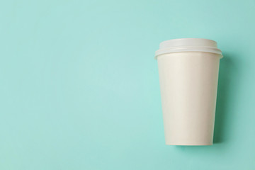 Simply flat lay design paper coffee cup on blue pastel colorful trendy background. Takeaway drink container. Good morning wake up awake concept. Template of drink mockup. Top view copy space