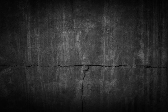 Crack black background. Grunge texture. Dark wallpaper. Blackboard. Chalkboard