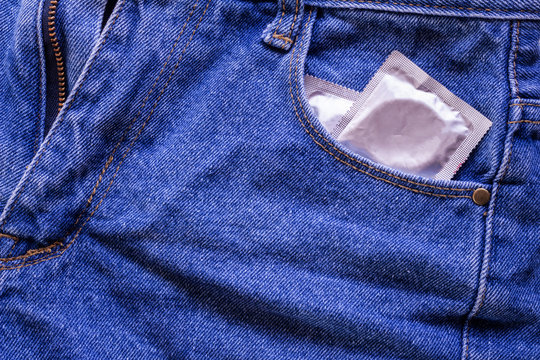 Condoms in package in jeans.