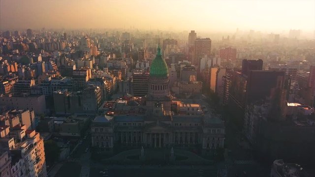 Aerial view the National Congress of Argentina during sunset. Buenos Aires. Camera flies forward and tilts.