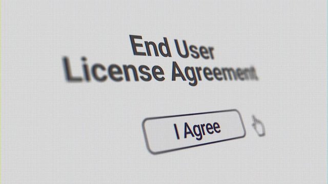 A simulated computer screen of a user clicking I Agree button on a end user license agreement form. 3D perspective. Clean and CRT versions included.  	