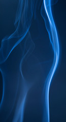 Abstract blue smoke swirls