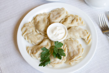 dumplings with sour cream and parsley