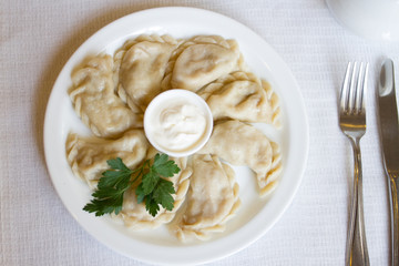 dumplings with sour cream and parsley