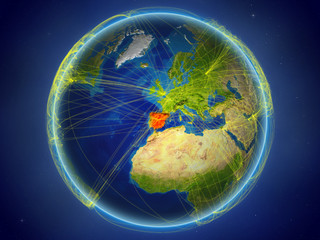 Spain from space on planet Earth with digital network representing international communication, technology and travel.