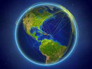 Dominican Republic from space on planet Earth with digital network representing international communication, technology and travel.