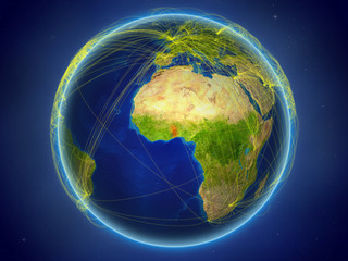 Togo from space on planet Earth with digital network representing international communication, technology and travel.
