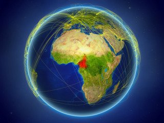 Cameroon from space on planet Earth with digital network representing international communication, technology and travel.