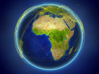 Equatorial Guinea from space on planet Earth with digital network representing international communication, technology and travel.